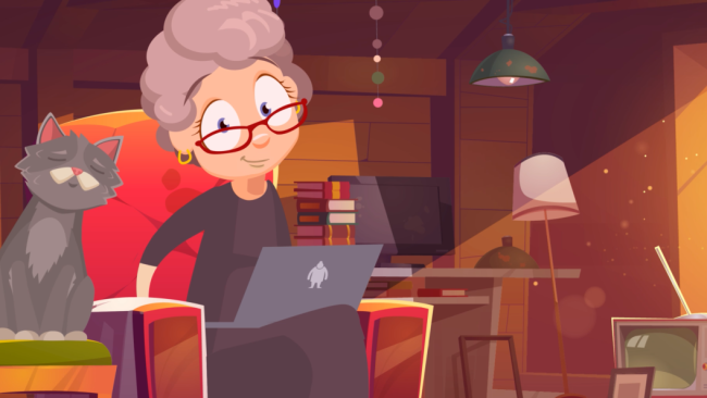 Granny Smith sitzt mit Laptop in ihrem Sessel. Daneben ihre Katze.