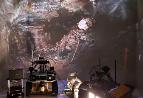 Mehrere Roboter in CAVE mit Scan des Bergwerks