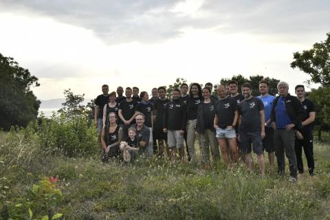 Participants of the 2019 scientific diving excursion on a meadow