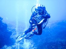 Picture of a diver with a video camera