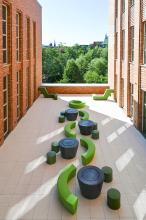 Terrace with tables, seating and trees