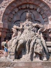Dr Steffen Trümper is searching for fossilised driftwood in front of the stone statue of the Staufer Emperor Frederick ‘Barbarossa’ at the Kyffhäuser Monument, which, at 81 metres, is one of the tallest monuments in Germany. 